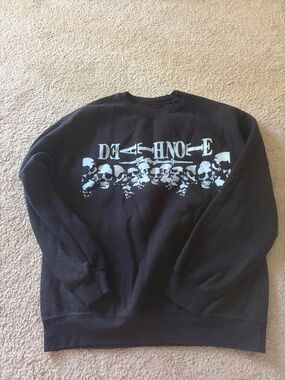 Black Crewneck Sweatshirt with Light Blue Skull Graphic